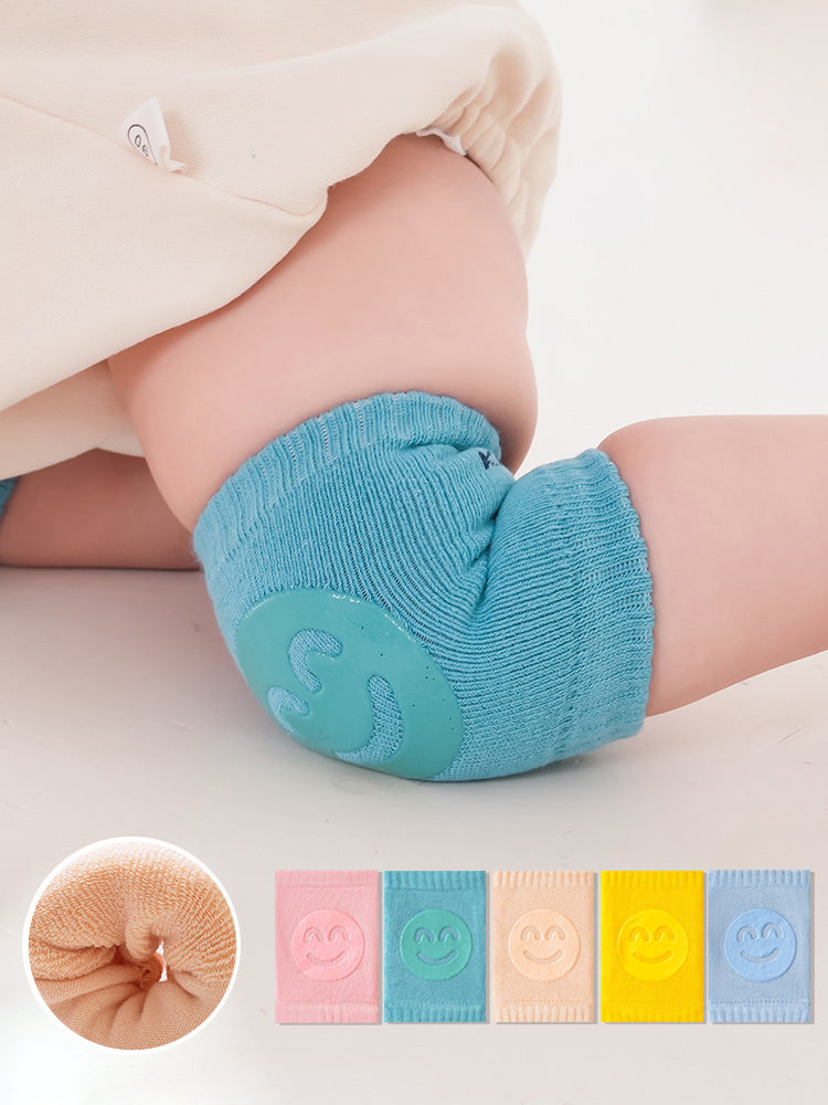 Blue baby knee pads on baby