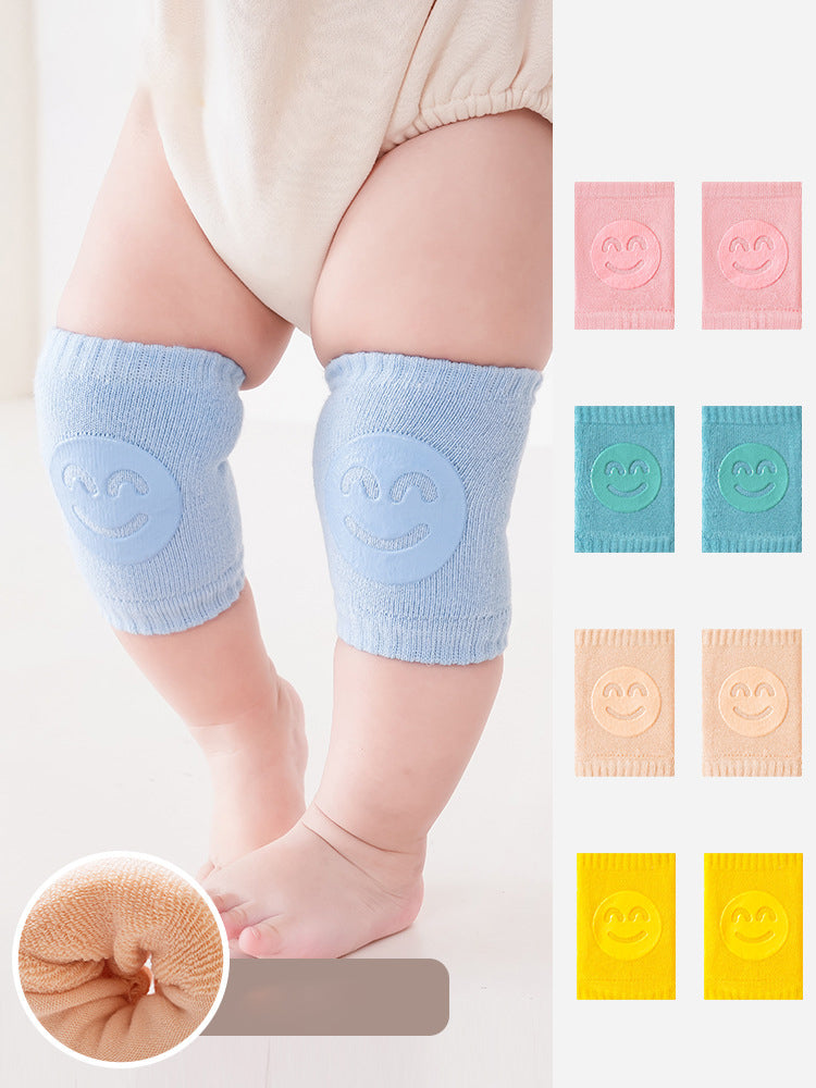 Light blue baby knee pads on baby