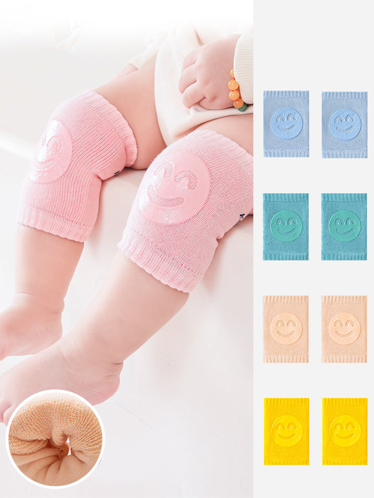 Pink baby knee pads on baby knees 2